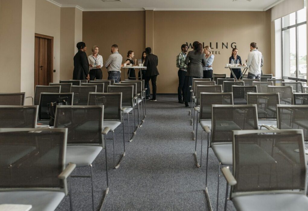 Business professionals networking in a conference room setting. &mdash; Photo by Pavel Danilyuk on Pexels