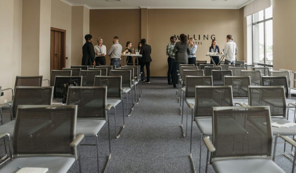 Business professionals networking in a conference room setting. &mdash; Photo by Pavel Danilyuk on Pexels