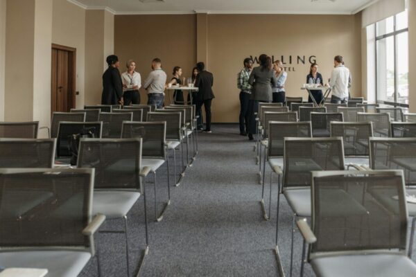Business professionals networking in a conference room setting. &mdash; Photo by Pavel Danilyuk on Pexels