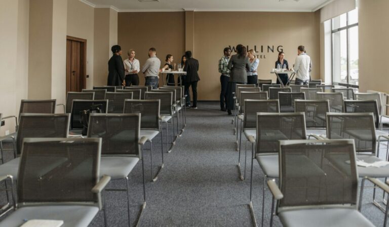Business professionals networking in a conference room setting. &mdash; Photo by Pavel Danilyuk on Pexels