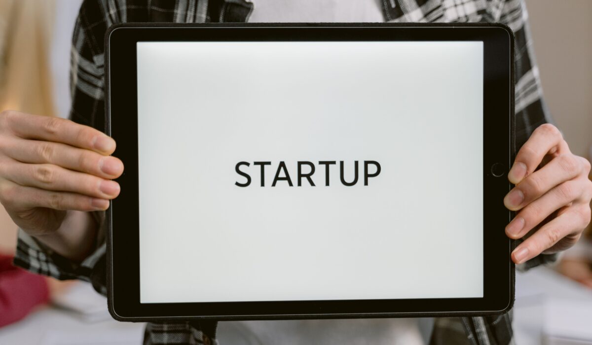 Person holding a digital tablet displaying the word 'STARTUP', representing new business concepts. — Photo by Tima Miroshnichenko on Pexels